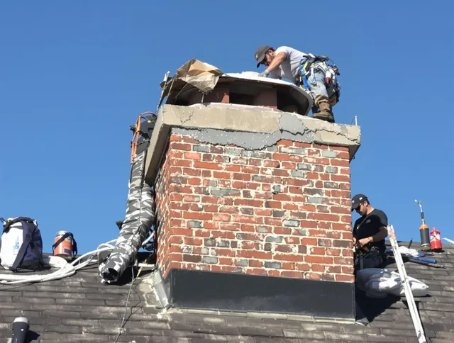 South Euclid Chimney Sweep installing a custom chimney crown in South Euclid, OH