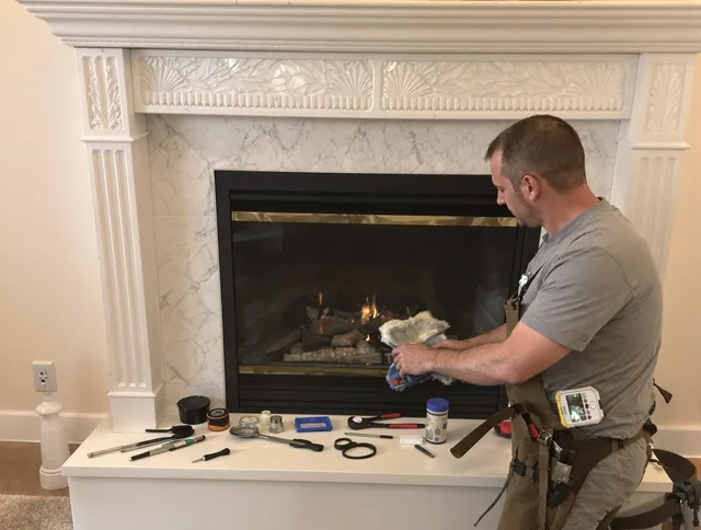 South Euclid Chimney Sweep performing fireplace maintenance in South Euclid, OH